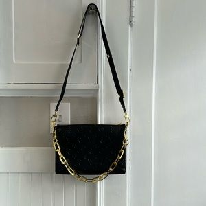 Excellent use condition condition. Black embossed Crossbody shoulder bag.